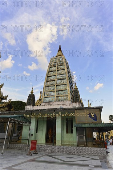 Shwedagon Pagoda, Yangon, Myanmar, Asia, The facade of a pagoda with intricate, ornate decorations