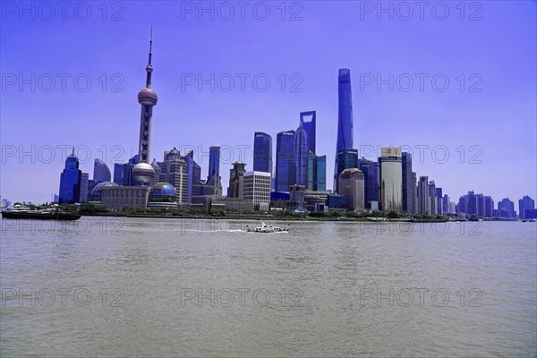 View from the Bund to the skyline at the Huangpu River with Oriental Pearl Tower, World Financial