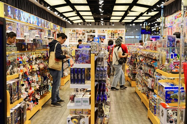 Stroll through Shanghai to the sights, Shanghai, China, Asia, people browse through a toy shop with