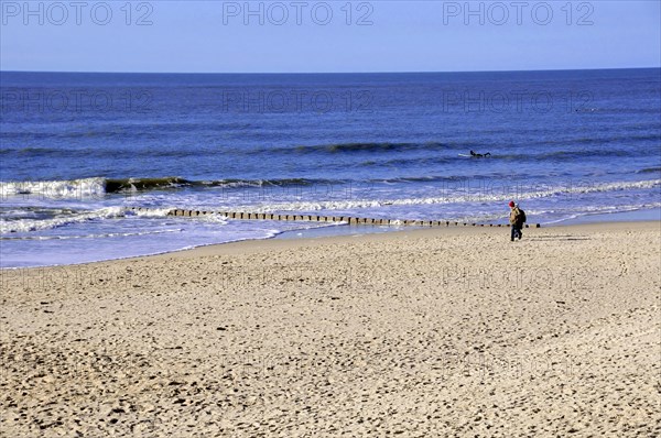 Westerland, Sylt, Schleswig-Holstein, Germany, Europe, Person walking along the edge of the sea