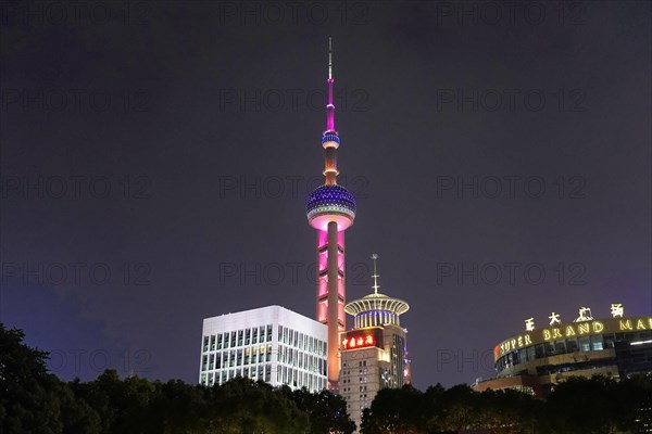 Oriental Pearl Tower, Pudong, Shanghai, China, Asia, The illuminated skyline at night with the