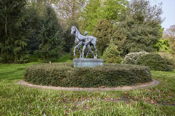 Sculpture Der Rosselenker by the sculptor Louis Tuaillon in the Wallanlagen park in Bremen,