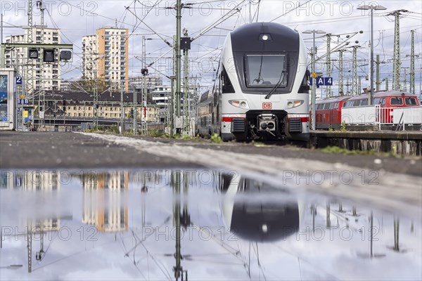 Stuttgart main station with track apron and arriving and departing trains. InterCity, Stadler KISS