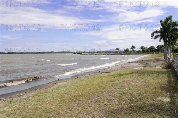 Granada, Nicaragua, A boardwalk overlooking the beach and undulating waters, Central America,