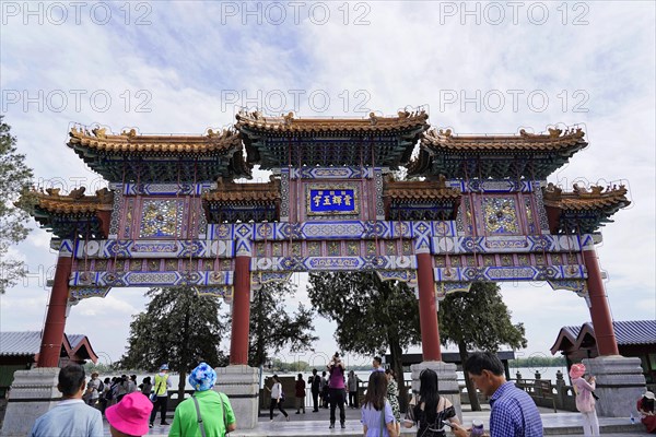 New Summer Palace, Beijing, China, Asia, People walk through a magnificent gate of traditional