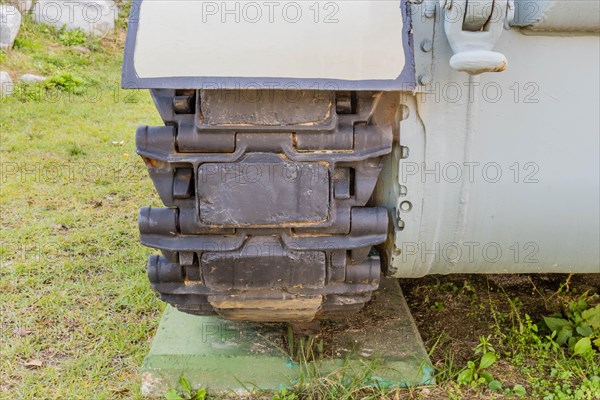 Closeup of metal tracks on military tank at public military history park in Nonsan, South Korea,