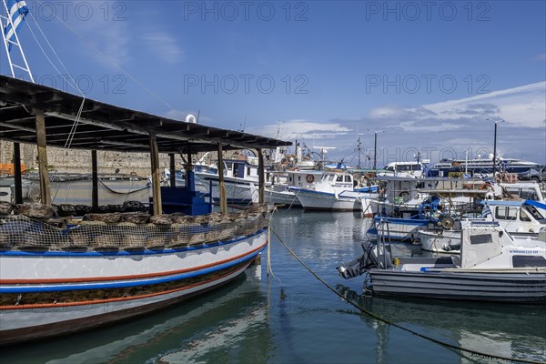 Boats anchoring in Kolona harbour in front of the city wall, Rhodes, Dodecanese archipelago, Greek