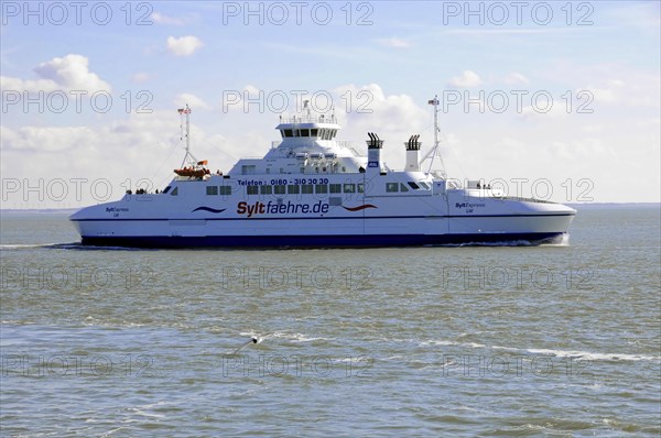Sylt, Schleswig-Holstein, A ferry of the Sylt ferry fleet glides over a calm sea under a clear blue