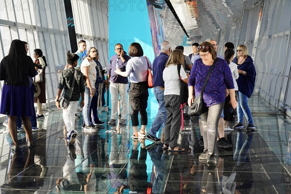 Viewing terrace, The Bottle Opener at 492 metres, A group of people stand in a modern glass