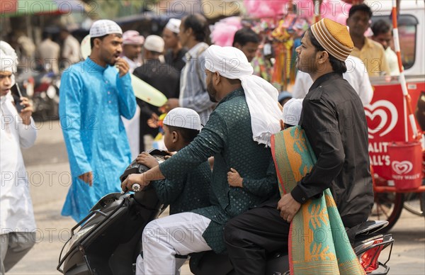 GUWAHATI, INDIA, APRIL 11: Muslim people with children walk towards an Eidgah to perform Eid