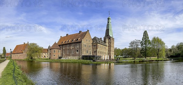 Panoramic photo View over moat to historic moated castle from Renaissance Raesfeld Castle reflected