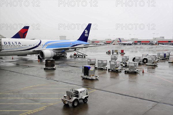 AUGUSTO C. SANDINO AIRPORT, Managua, Nicaragua, A Delta Airlines plane parked at the wet airport