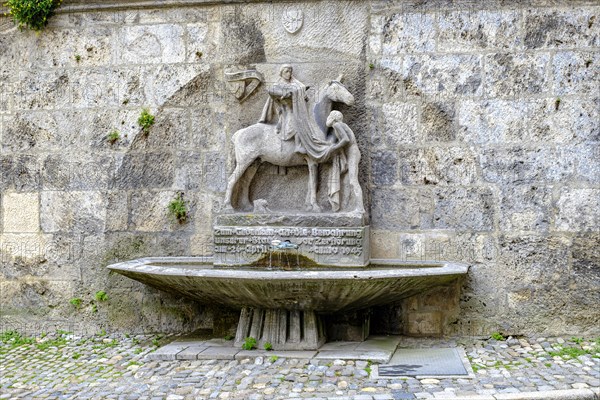 The Martin Fountain at the northeast corner of St. Martin's Church in Memmingen in Unterallgaeu,