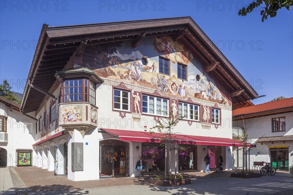 Lueftlmalerei on old house facade with shop in the pedestrian zone of Garmisch, Garmisch district,