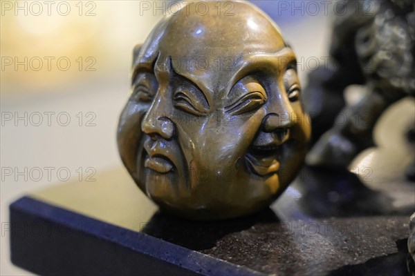 Xian, Shaanxi Province, China, Asia, A detailed bronze sculpture with two different faces and