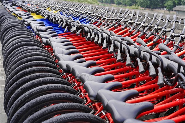 Rental bicycles, Xian, Shaanxi, China, Asia, Orderly rows of bicycles with red frames in a public