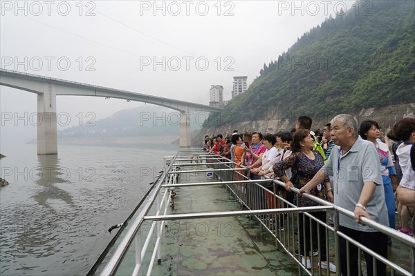 Cruise ship on the Yangtze River, Hubei Province, China, Asia, tourists stand at the railing of a