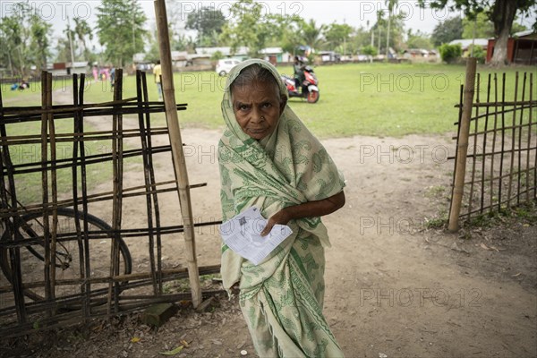 BOKAKHAT, INDIA, APRIL 19: An elderly woman arrives at a polling station to cast her vote during
