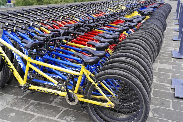 Rental bicycles, Xian, Shaanxi, China, AsiaArranged rows of bicycles in different colours for