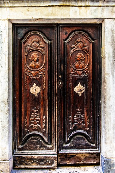 Old town alley with antique door, harbour town of Piran on the Adriatic coast with Venetian flair,
