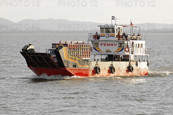 Lake Nicaragua, Ometepe Island in the background, ferry leaving a wave track on the lake, with