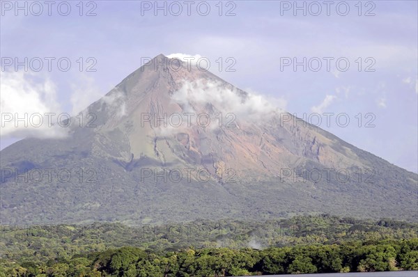 Lake Nicaragua, in the background the island of Ometepe, detailed view of an active volcano with