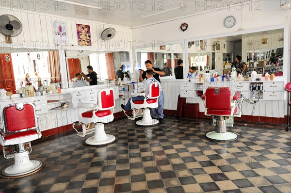 Granada, Nicaragua, Interior view of a traditional hairdressing salon with red and white barber