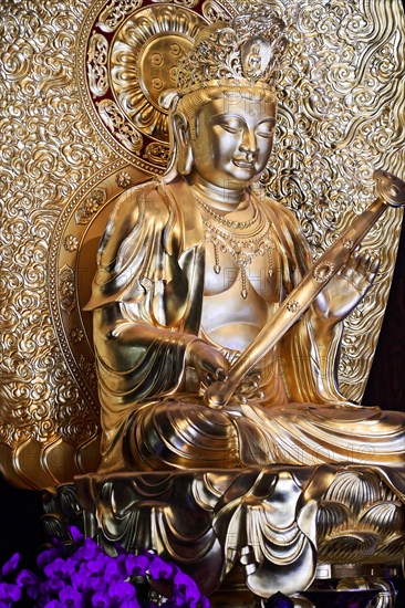 Jade Buddha temple, Shanghai, Detailed golden Buddha statue with fine handwork and ornate