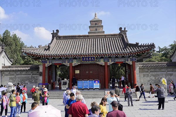Chongqing, Chongqing Province, China, Asia, Entrance gate to a Chinese temple with people and
