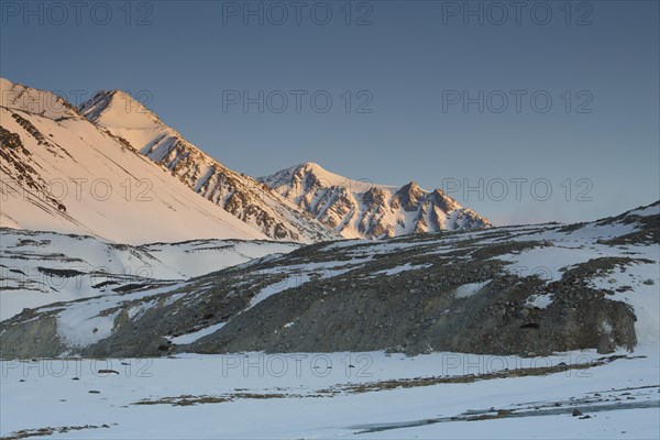 Sunrise at the snowy Cold Peak, Mongolian Chueiten, 3373m, Tavan Bogd National Park, Mongolian