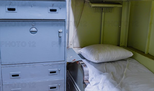 Bunk bed and cabinet in sailor's cabin on board battleship at Unification Park in Gangneung, South