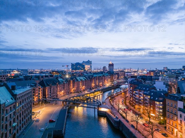 Aerial view of Speicherstadt Hamburg and the Elbe Philharmonic Hall with customs canal at blue