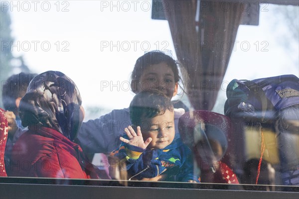 Syrian refugees have arrived at Schoenefeld station on a special train. They are then taken by bus