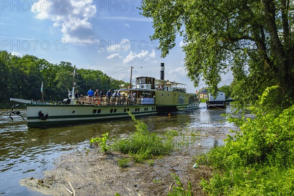 The historic paddle steamer KURORT RATHEN has docked at the steamer landing stage in Pillnitz,