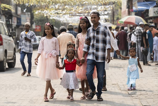 GUWAHATI, INDIA, APRIL 11: Muslim people with children walk towards an Eidgah to perform Eid