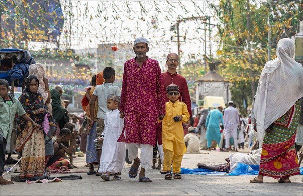 GUWAHATI, INDIA, APRIL 11: Muslim people with children walk towards an Eidgah to perform Eid