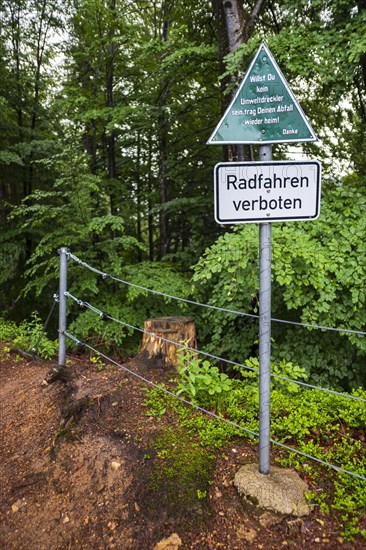 Keeping the environment clean, message to polluters and cyclists on a sign at the upper entrance to