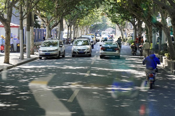 Traffic in Shanghai, Shanghai Shi, A group of vehicles, including cars and motorbikes, on a