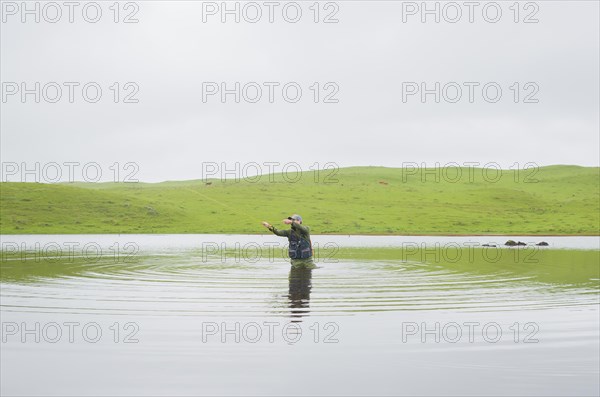 Black bass fisherman fishing with flyfishing, Cambara do sul, Rio Grande do sul, Brazil, South