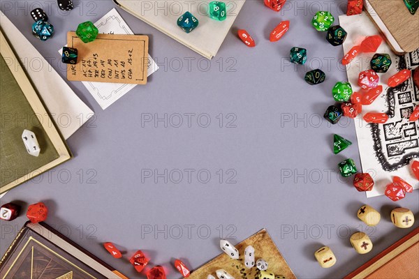 Tabletop role playing flat lay background with RPG dices, rule books, dungeon map and copy space in