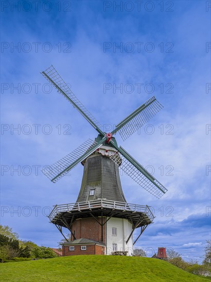 The Green Mill, one of Greetsiel's twin mills, on the Old Greetsiel Sieltief, Greetsiel,