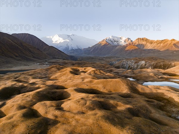 Aerial view, high mountain landscape with glacial moraines and mountain lakes, behind Pik Lenin,