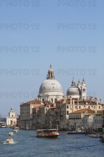 Water taxis, and vaporetto with Renaissance architectural style palace buildings and Santa Maria