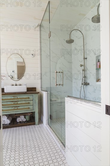 Green antique finish pine wood vanity with rustic wood plank countertop and white top-mounted