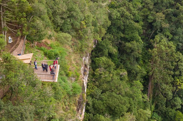 CANELA, BRAZIL, May 12, 2019. Tourists observing a snail cascade (Cascade of Caracol) in park