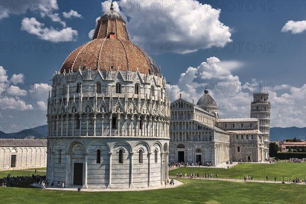 The Cathedral of Santa Maria Assunta and Baptistery with the Leaning Tower of Pisa under a blue sky