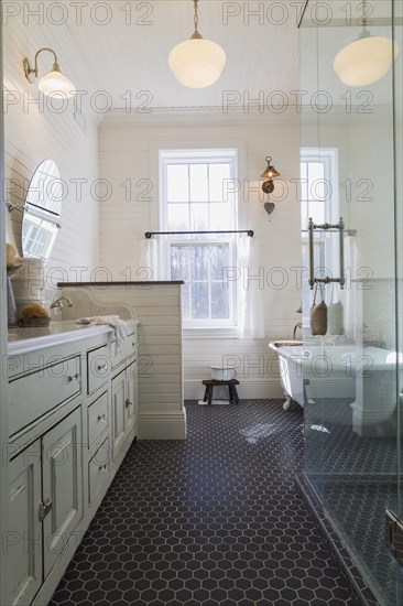 White antique style finish vanity with quartz countertop and two sunken sinks, freestanding claw