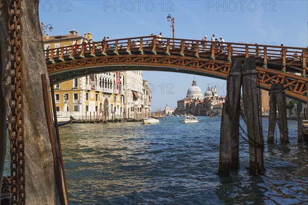 Accademia footbridge over Grand Canal with water taxis, Renaissance architectural style residential