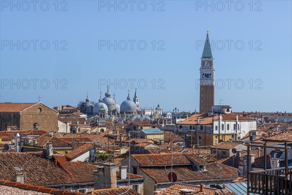 View over the roofs of Venice to the Campanile bell tower and the domes of St Mark's Basilica, view