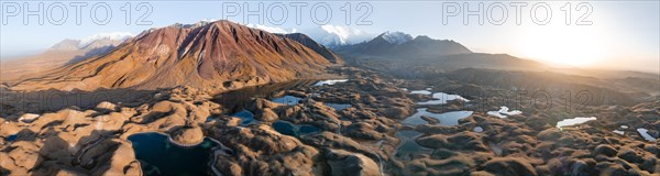 Aerial view, high mountain landscape with glacial moraines and mountain lakes, behind Pik Lenin,